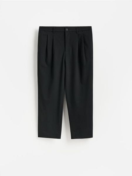 Spodnie jogger z dodatkiem wiskozy - czarny. Czarne joggery i bojówki Reserved, l, bez wzorów, z tkaniny. Za 159.99 zł.