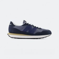 Buty klasyczne męskie New Balance 237 Lifestyle (M2374EK). Niebieskie sztyblety New Balance, bez wzorów, bez obcasa, bez zapięcia. Za 289.00 zł.