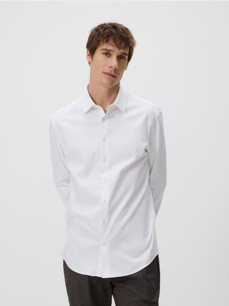 Koszula slim z bawełny egipskiej - biały. Białe koszule Reserved, l, bez wzorów, z bawełny, bez kołnierzyka, bez ramiączek. Za 139.99 zł.