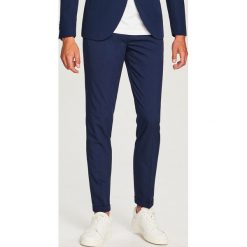 Spodnie garniturowe slim fit - Granatowy. Eleganckie spodnie Reserved. Za 149.99 zł.