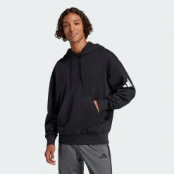 Bluza z kapturem Essentials Loose-Fit 3 Bar Logo French Terry. Czarne bluzy Adidas, l, bez wzorów, z materiału, z kapturem. Za 279.00 zł.