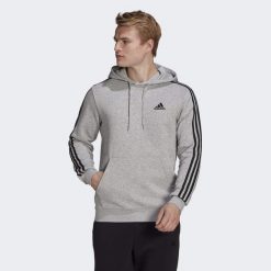 Bluza z kapturem adidas Essentials Fleece, Mężczyźni. Czarne bluzy Adidas, l, bez wzorów, z bawełny, z kapturem. Za 222.00 zł.