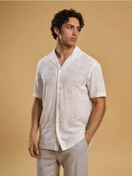 Wiskozowa koszula ze wzorem - kremowy. Białe koszule Sinsay, l, bez wzorów, z wiskozy, bez kołnierzyka, bez ramiączek. Za 49.99 zł.