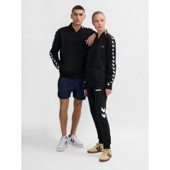 Kurtka z dresu Hummel Hmlarchive Regular Poly. Czarne kurtki Hummel, bez wzorów, z dresówki, bez kaptura. Za 281.05 zł.