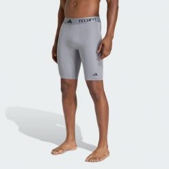 Krótkie kompresyjne legginsy treningowe TECHFIT. Czarne legginsy długie sportowe Adidas, l, bez wzorów, z elastanu, na fitness i siłownię, techfit (adidas). Za 129.00 zł.