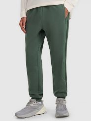 4F Spodnie dresowe w kolorze zielonym rozmiar: L. Zielone spodnie treningowe długie 4F, l, bez wzorów, z dresówki. Za 106.38 zł.
