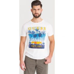 T-SHIRT Guess. Białe t-shirty Guess, l, z aplikacjami, z bawełny, bez kołnierzyka, bez ramiączek. Za 113.40 zł.