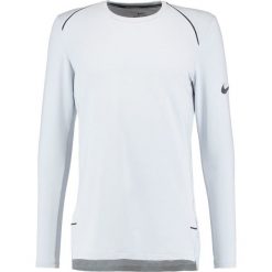 Nike Performance Koszulka sportowa pure platinum. Koszulki z długim rękawem Nike Performance. W wyprzedaży za 155.40 zł.